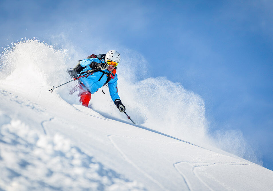 Male freeride skier in the mountains